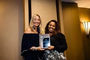 Dr. Wright (on the right) receiving her Rising Star Award